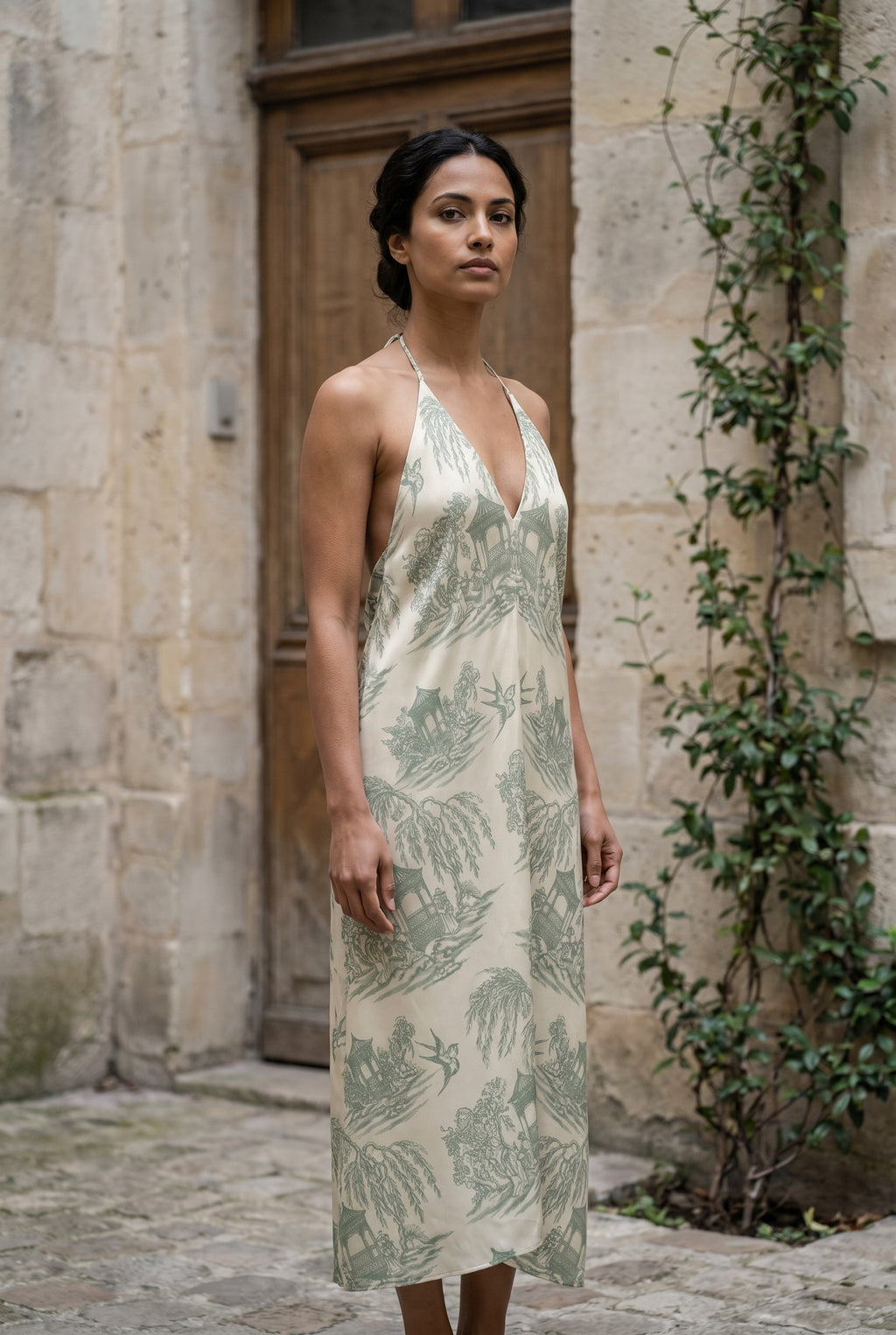 La Demoiselle — Toile Bridesmaid Halter (Dusty Green Light) — stone courtyard 2x3