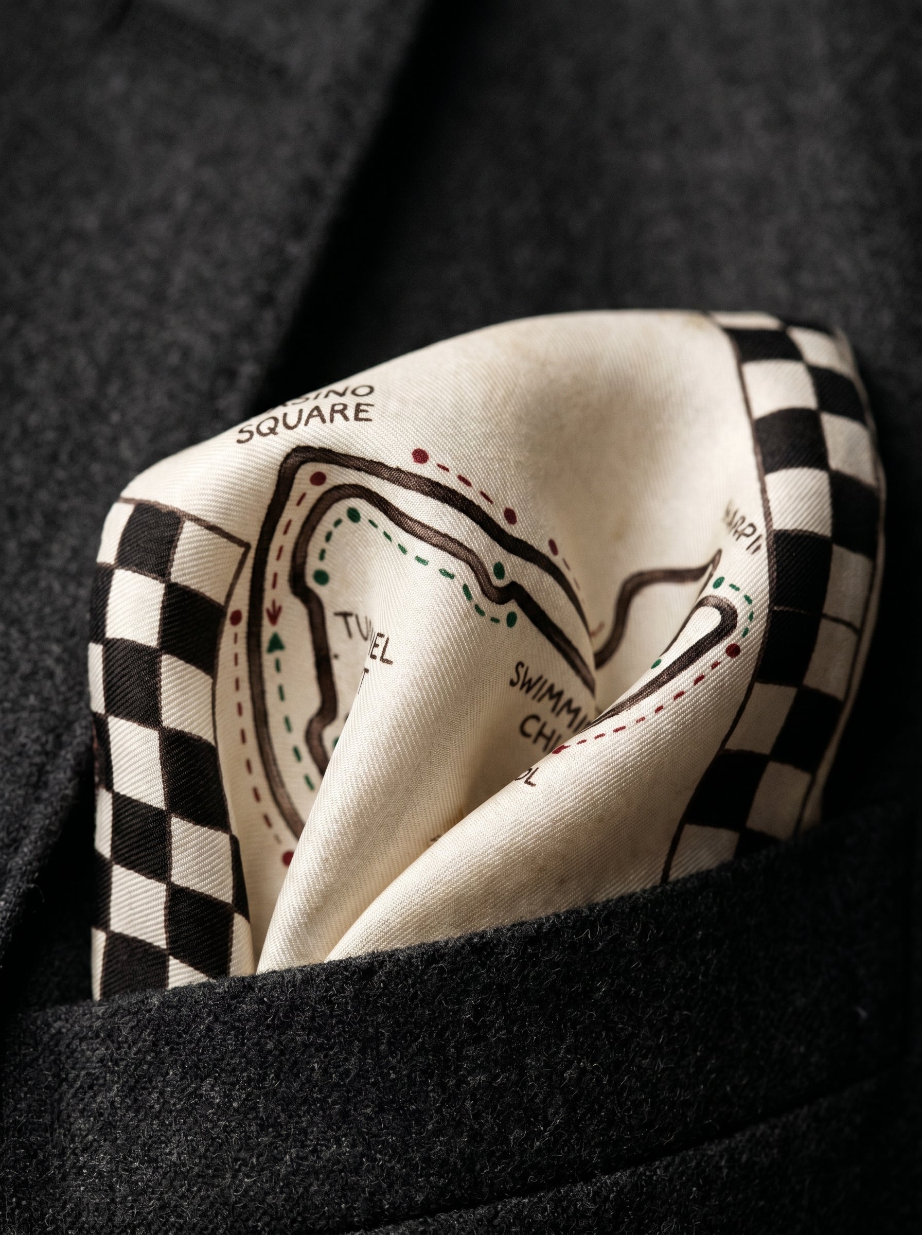 Pochette Monaco Grand Prix — on-model editorial on fitted suit — luxury silk charmeuse and smooth leather — Hoboken atelier