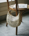 Le Demi-Lune in Codex Stellaire — hero flatlay on light grey — Italian nappa leather with celestial print — Hoboken atelier